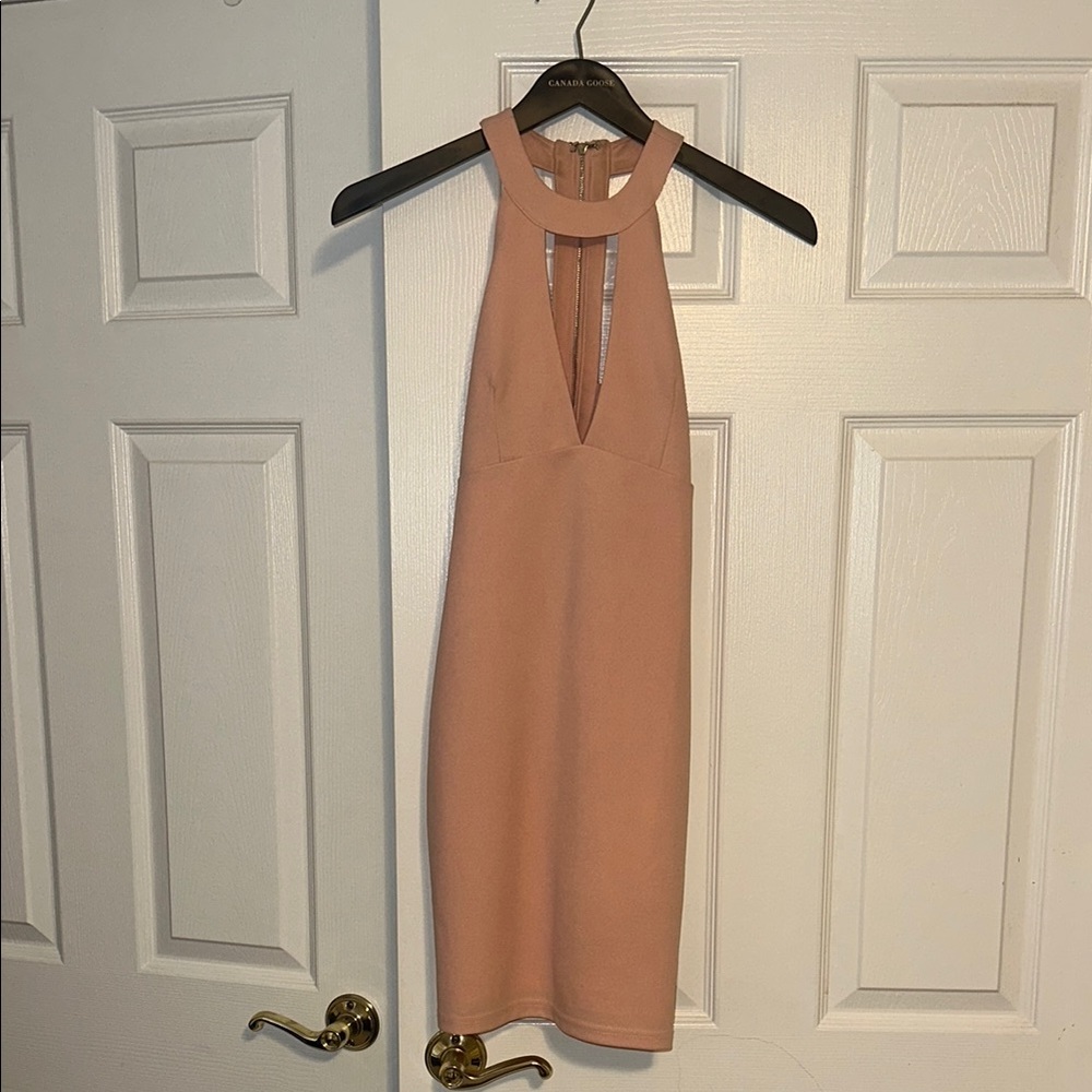 Light pink mini dress with back cut out detail and key hole detail size small